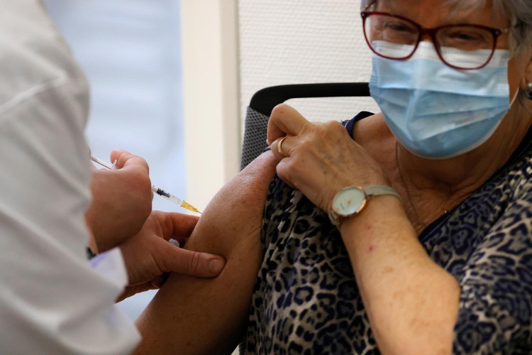 French COVID-19 cases, patient numbers ease as AstraZeneca inoculations start