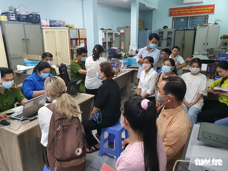 Vietnamese police offer food, entertainment as queue for ID registration lasts till midnight