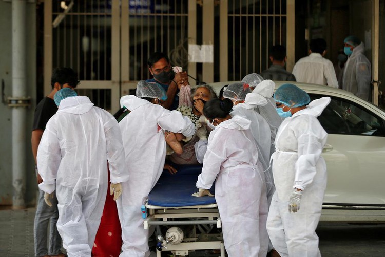 Hospitals run short of beds as Asia's COVID-19 cases surge