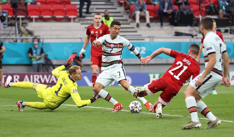 Portugal's record-breaking Ronaldo sinks battling Hungary