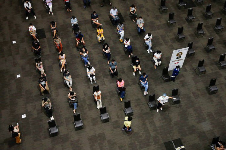 Chickens, cows, apartments offered up in Asia's vaccination lucky draws