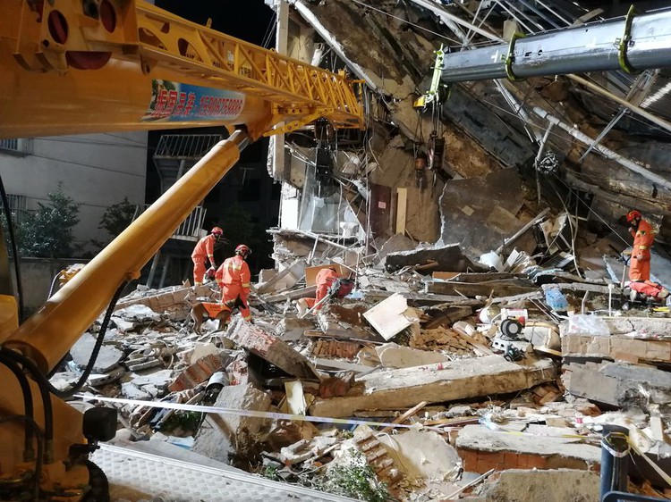 China hotel collapse kills eight; rescuers search for nine missing
