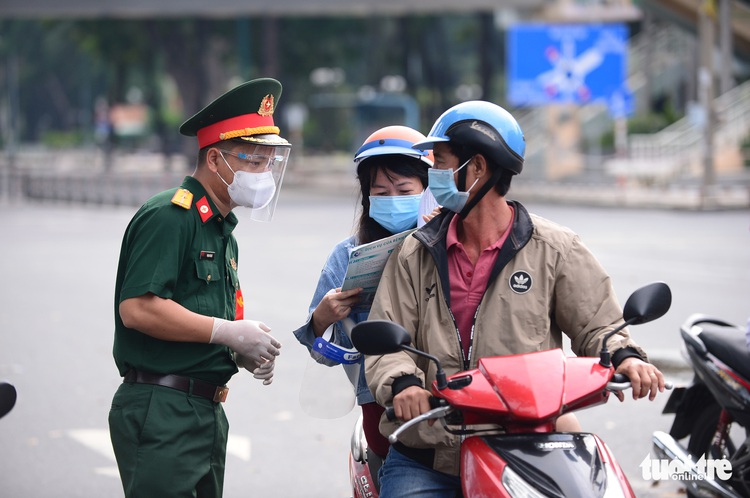 Who can go outside during the shelter-in-place order in Ho Chi Minh City?
