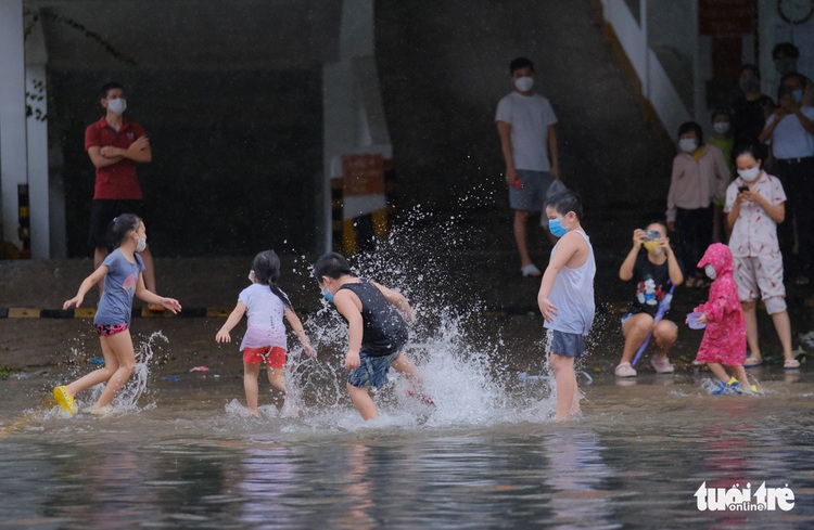 In Da Nang, people catch fish on deluged downtown streets