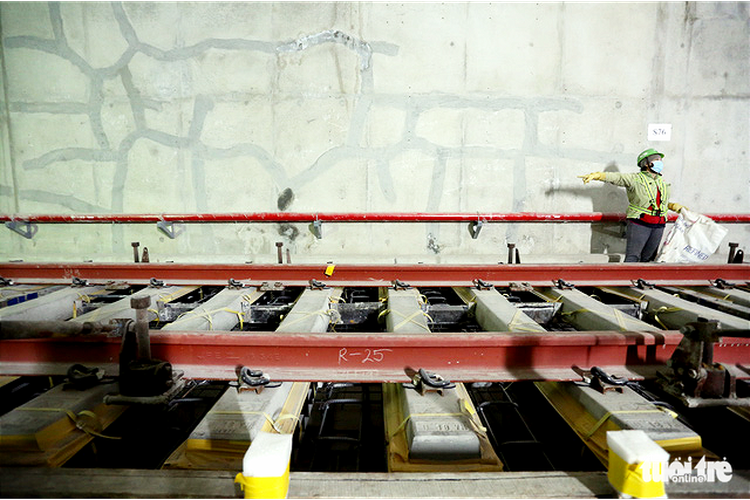 Construction workers install final rail section on Ho Chi Minh City’s first metro route