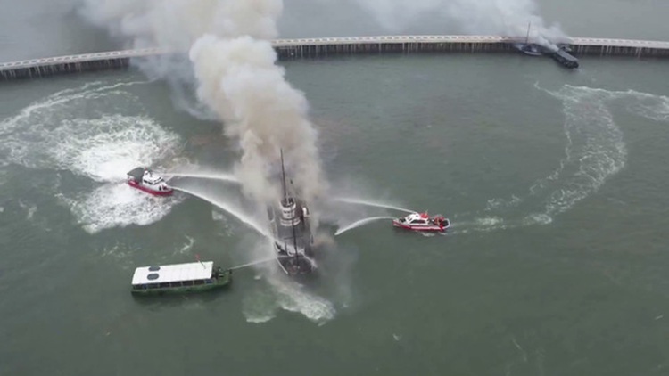 Empty cruise ships on fire in Ha Long Bay in northern Vietnam