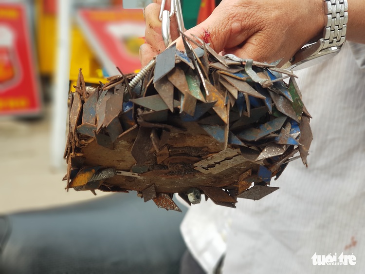 Tire-puncturing nails litter suburban road in Ho Chi Minh City