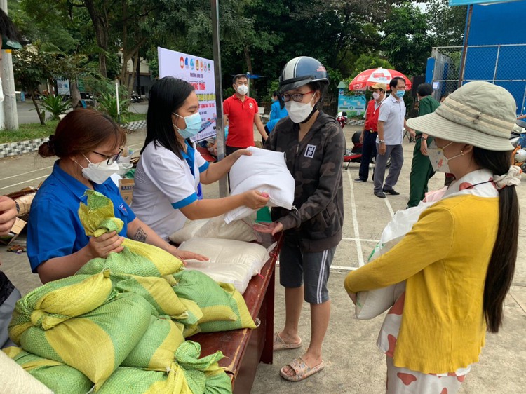 Residents exchange recyclables for rice in Ho Chi Minh City