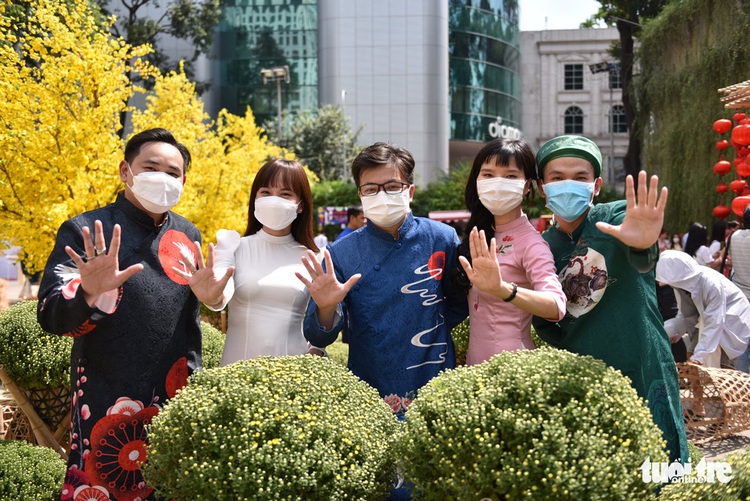 Ho Chi Minh youths pose with yellow apricots as Lunar New Year approaches