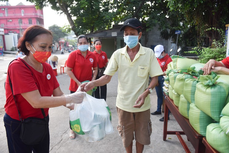 Residents exchange scrap for rice in Ho Chi Minh City