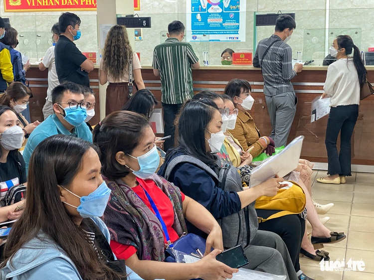 Residents crowd immigration department for passport application in Hanoi