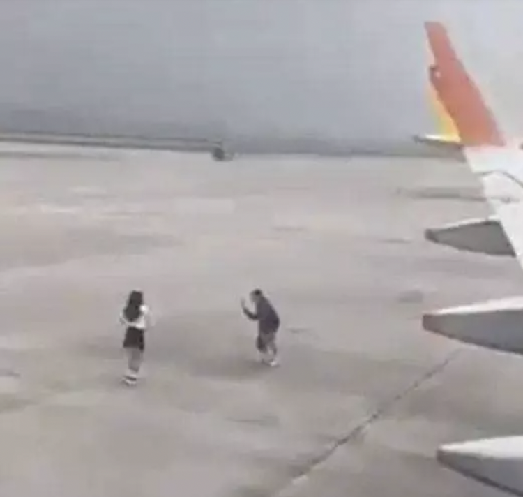 Vietnamese aviation authority probes into video of man filming woman dancing on airport apron