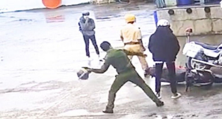 Police officers suspended over video of them roughing up motorcyclist in Vietnam