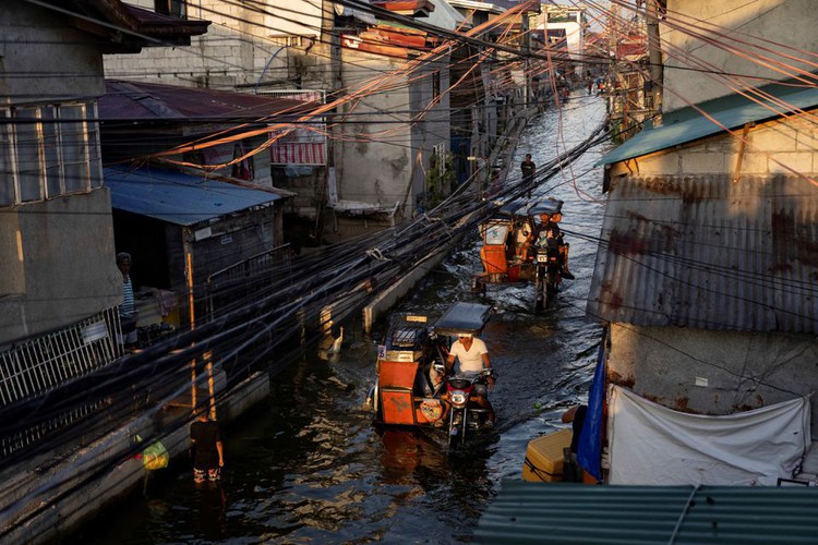 Philippines town gives taxis a lift as floods become norm