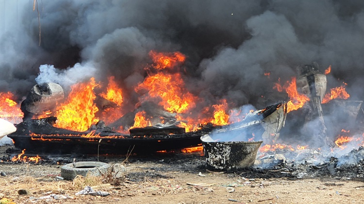 Fire engulfs motorboats at yard near Ho Chi Minh City river