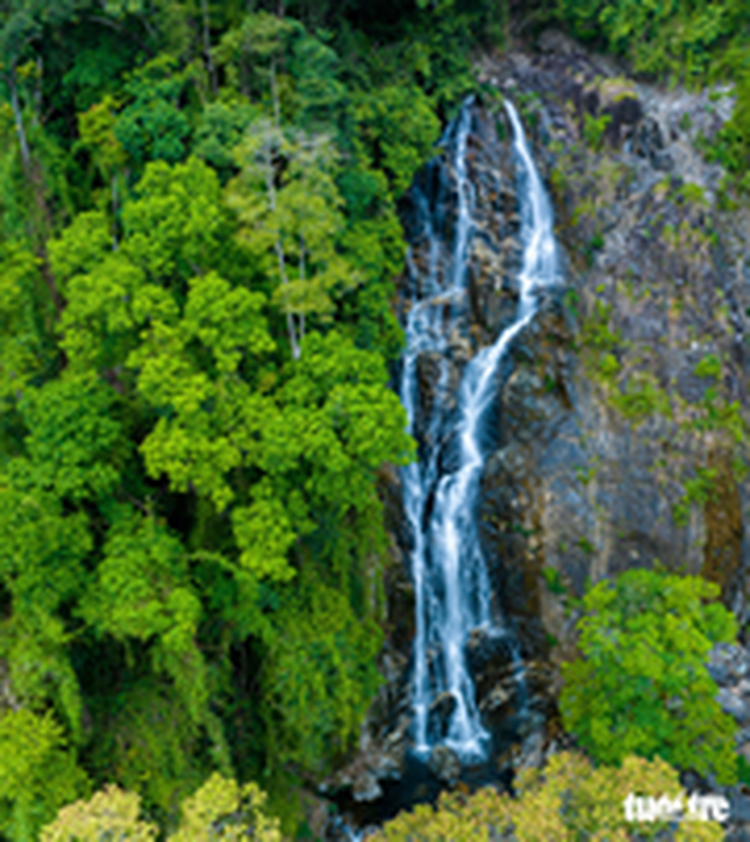 In south-central Vietnam, four-story waterfall nestled in virgin forest enchants backpackers