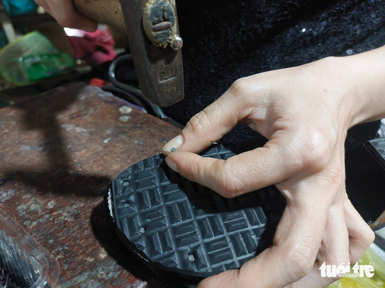 Woman spends 3 decades making traditional clogs by hand in Vietnam