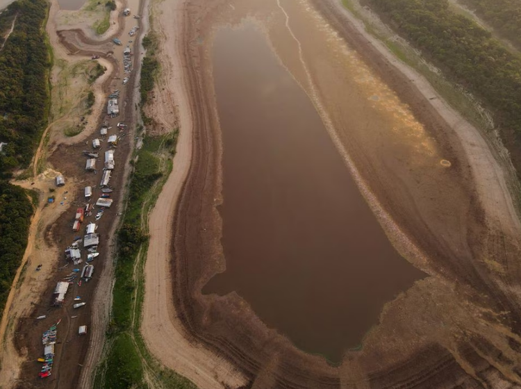 Amazon drought strands floating Brazilian village on lake turned into mud