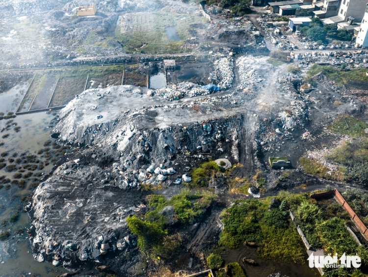 Dust, smoke blanket aluminum recycling village in northern Vietnam