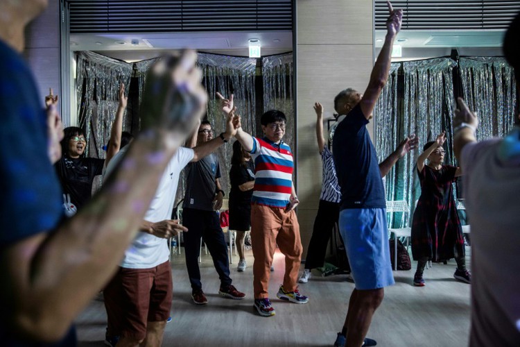 Disco, dogs help Hong Kong's elderly out of post-COVID isolation
