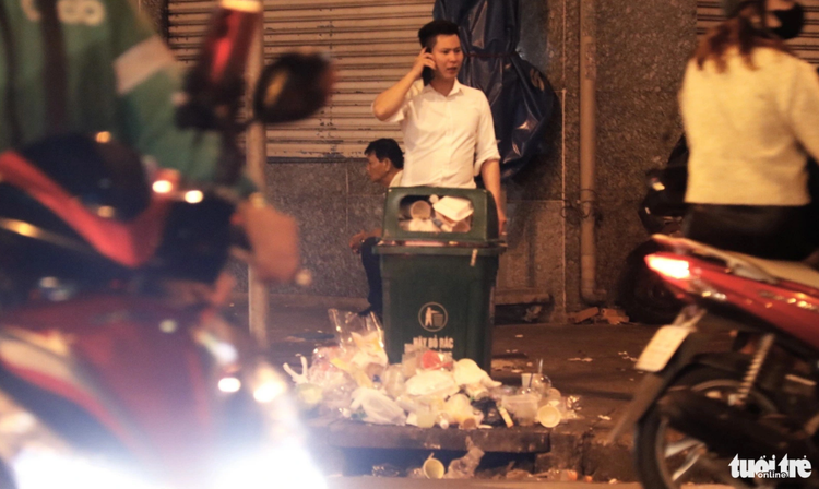 Many Ho Chi Minh City streets flooded with trash on Christmas Eve