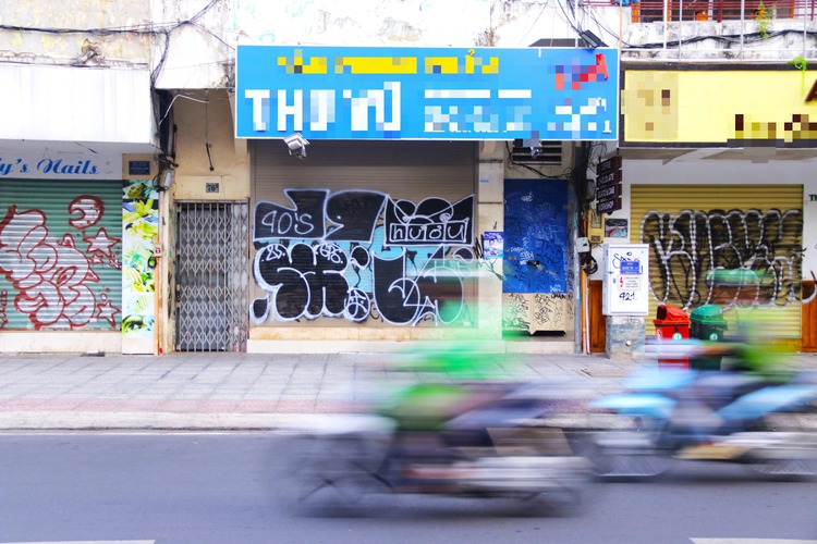 Le Loi Blvd in downtown Ho Chi Minh City hit by graffiti vandalism