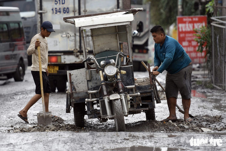 Road full of potholes becomes nightmare for commuters in southern Vietnam