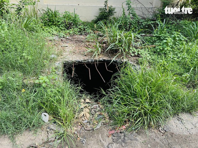 Uncovered, degraded manholes a hazard to commuters in southern Vietnam