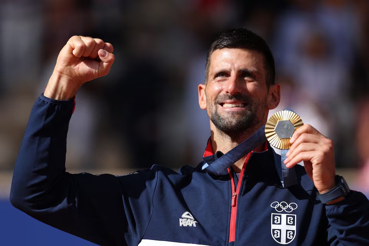 Djokovic fights off Alcaraz to finally strike gold