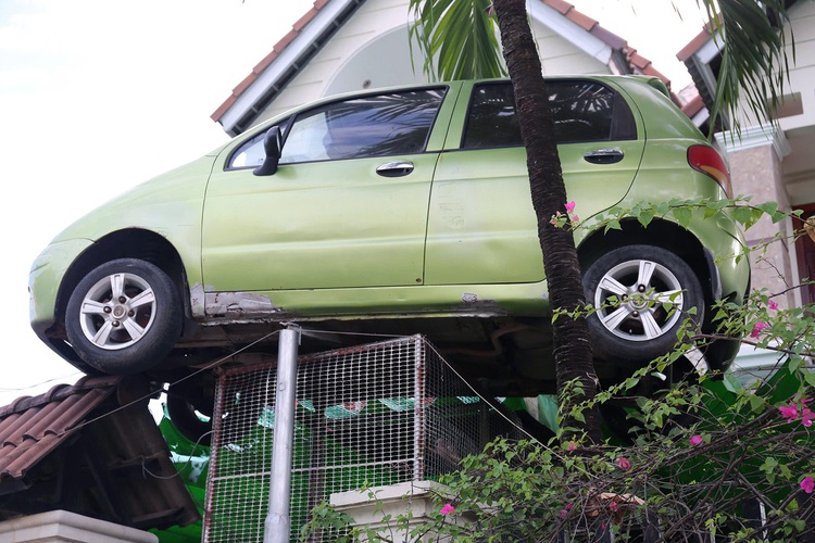 In southern Vietnam, this family's car-topped gate is a real head-turner