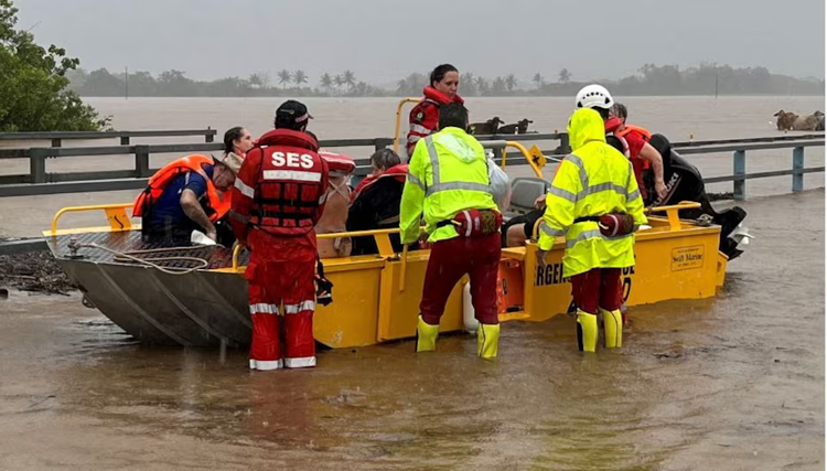 One dead, thousands urged to evacuate as Australia's northeast battles floods