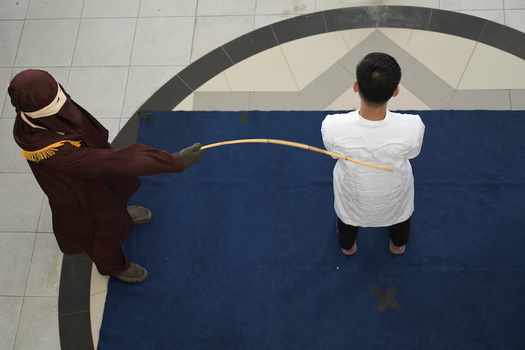 Indonesia's Aceh province publicly canes two men for same-sex relationship