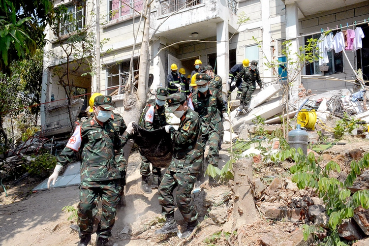 Vietnam’s rescuers work in area believed to have 40 people buried in Myanmar