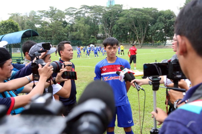 Nguyen Van Toan speaks to reporters.