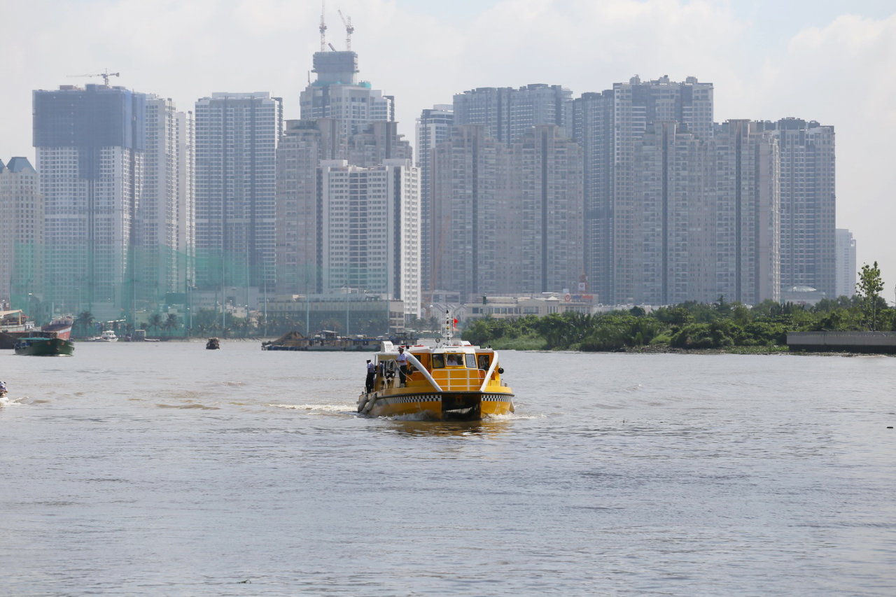 The river bus travels along the Saigon River on August 21, 2017.