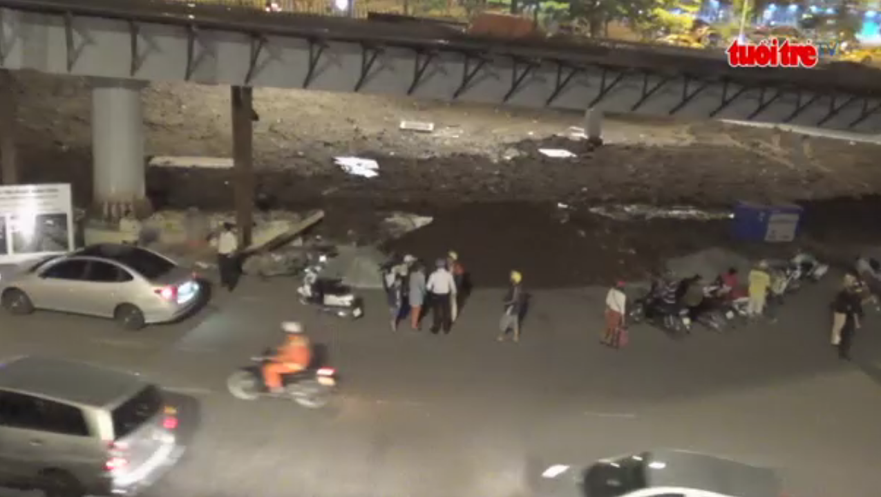 Multiple vehicles pulled over under the flyover leading to Tan Son Nhat Airport.