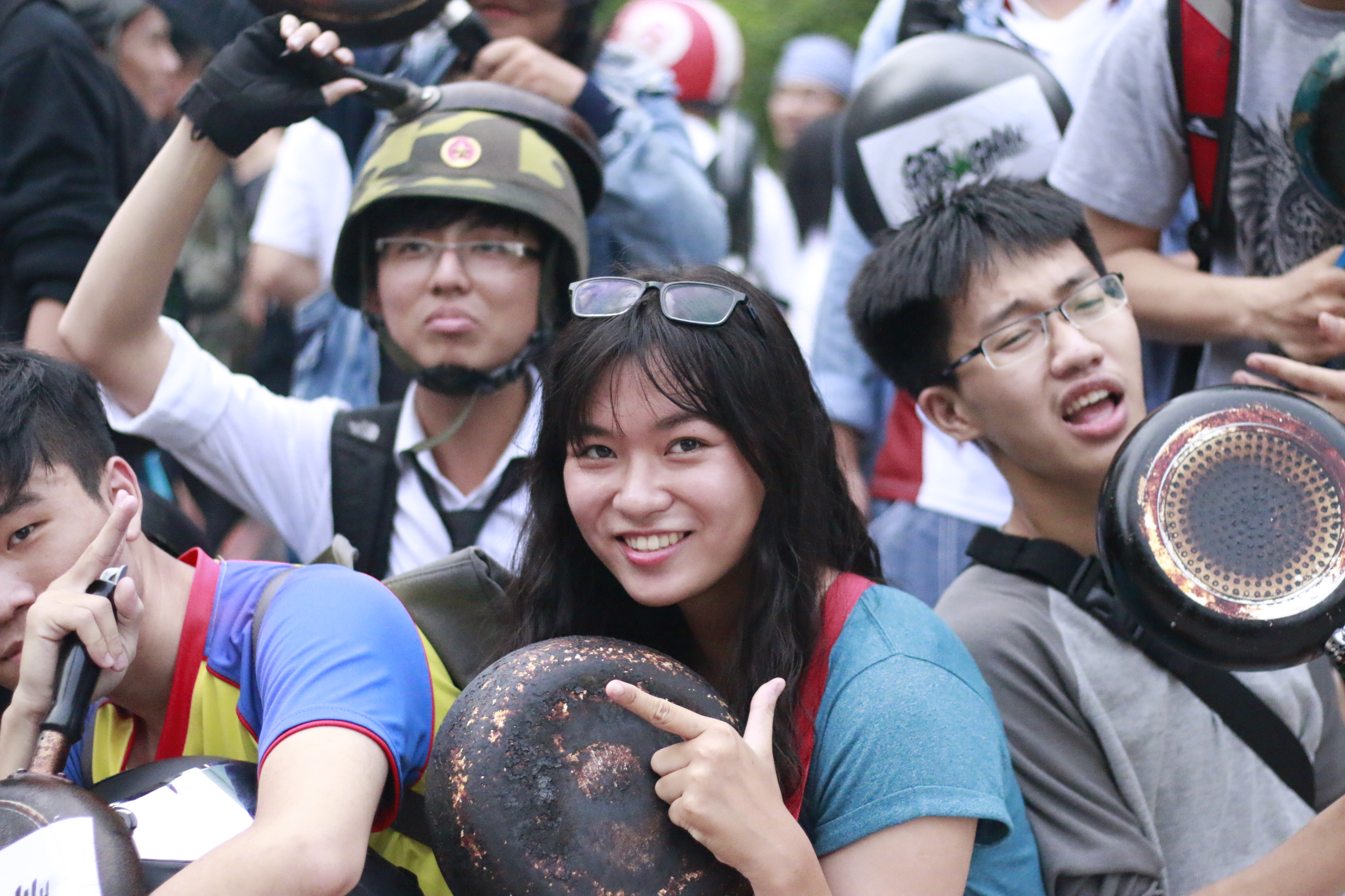 Ho Chi Minh City youths pose playfully with their pans.