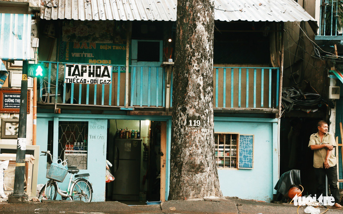 Plain contrast small sign of a grocery, indicating the simplicity of the Saigonese