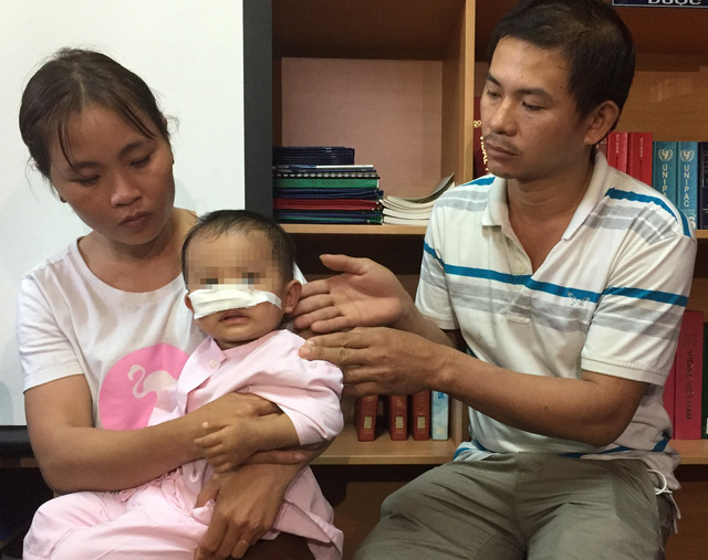 The family of a boy who was mauled by a family-raised German shepherd in Dak Lak Province. Photo: Tuoi Tre