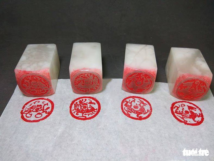 The seals with the four holy beasts: the azure dragon, vermillion bird, white tiger and black turtle. Photo: Tuoi Tre