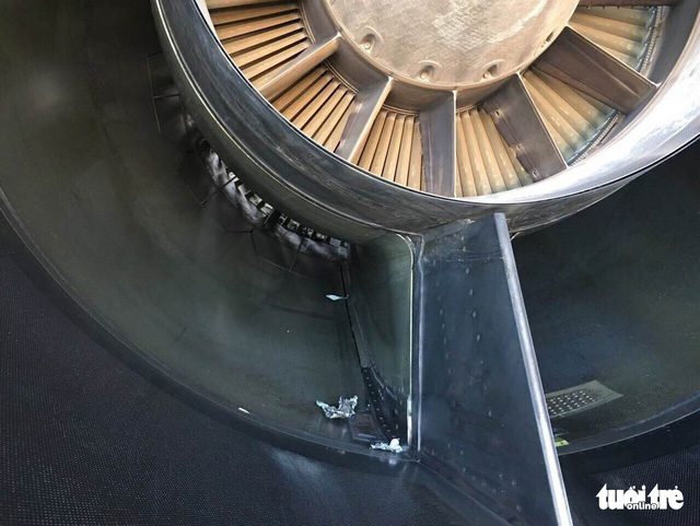 Debris believed to be construction materials are seen in the plane engine.