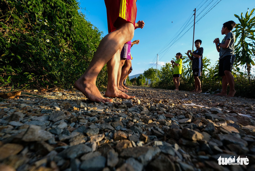 Team members warm up before their training. Photo: Tuoi Tre