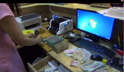 Money and other exhibits found at the gambling ring in this photo supplied by officers.