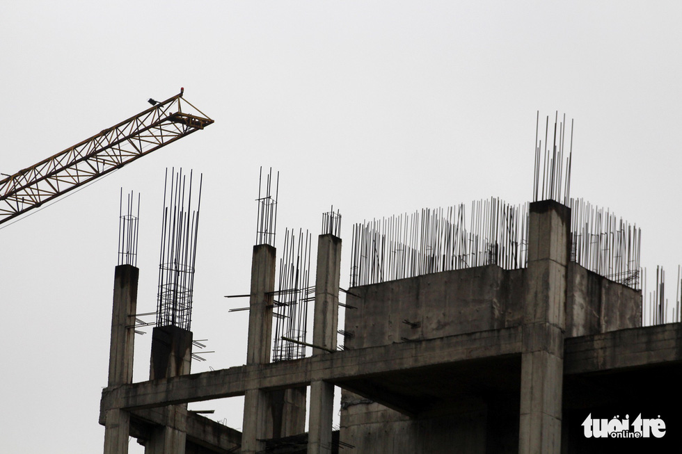 Bare iron rods are seen at the top of the unfinished hospital in Nam Dinh Province, Vietnam. Photo: Tuoi Tre