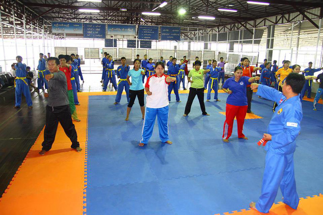 A Vietnamese Vovinam martial artist is pictured during a practice session with a Myanmarese fellow. Photo: Tuoi Tre