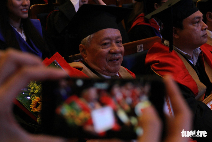 Le Phuoc Thiet sits during a convocation in Da Nang, central Vietnam, on June 10, 2018. Photo: Tuoi Tre