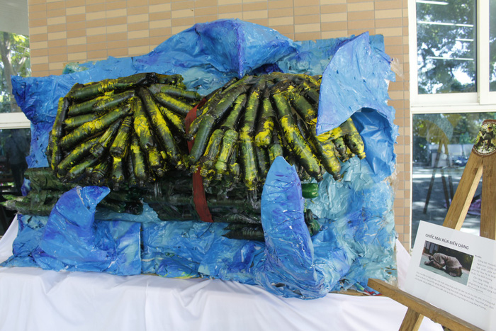 An object describing a turtle that has a figure-eight shape due to being caught in a rubber band for multiple years is seen at the ‘Plastic Monster’ exhibition in Da Nang, Vietnam, June 30 and July 1, 2018. Photo: Tuoi Tre