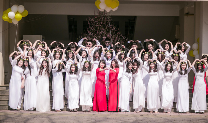 Phan Thi Hanh (fourth from right, bottom row) can be seen with her high school classmates in this supplied photo.