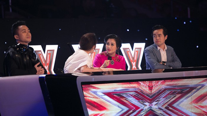 Tung Duong (left) judges at the Vietnamese X-Factor TV show in this photo provided by the organizers