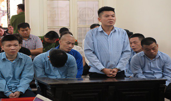 The defendants stand trial at the Hanoi’s People’s Committee. Photo: Tuoi Tre